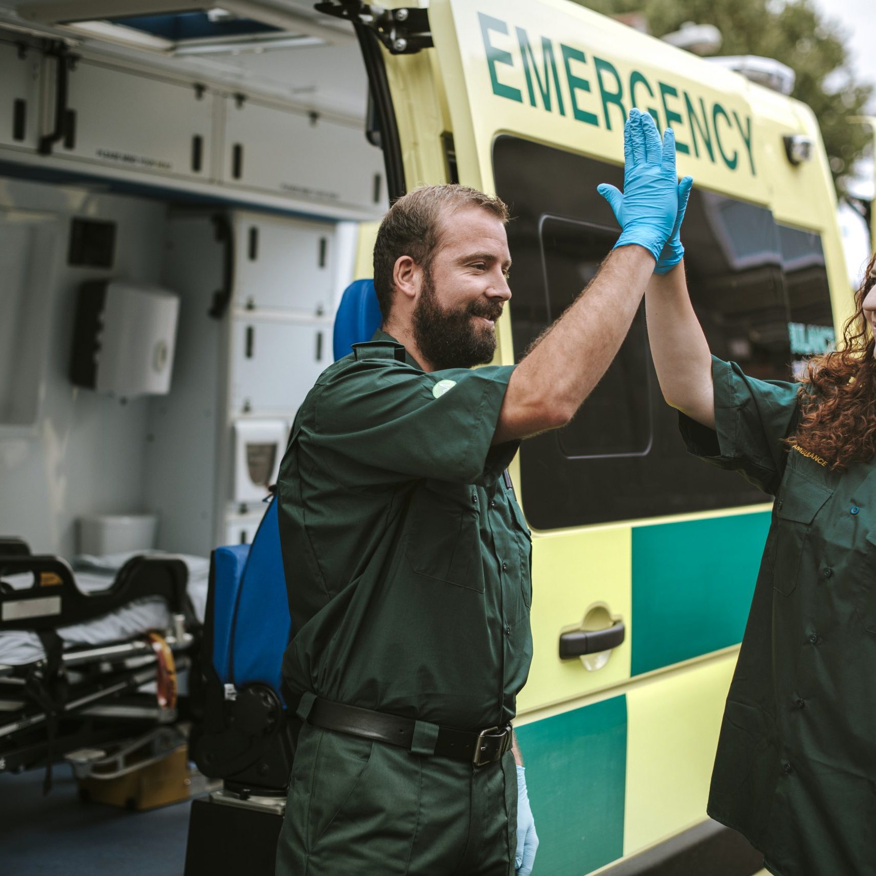 Paramedics at work with an ambulance Paramedics at work with an ambulance